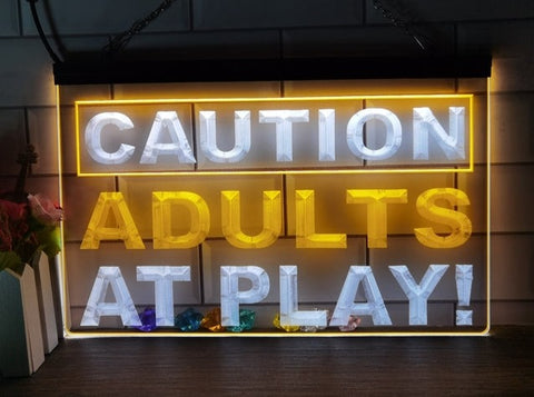 Image of Caution Adults At Play Two Tone Illuminated Sign