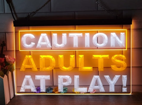 Image of Caution Adults At Play Two Tone Illuminated Sign