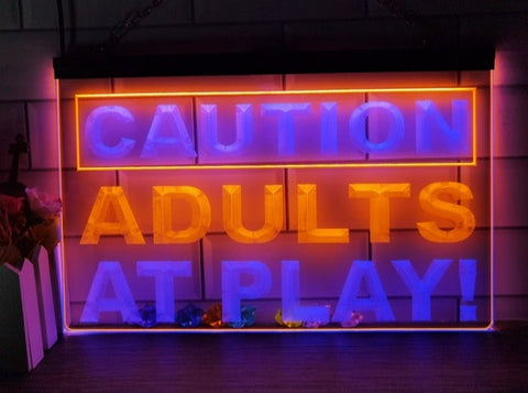 Image of Caution Adults At Play Two Tone Illuminated Sign